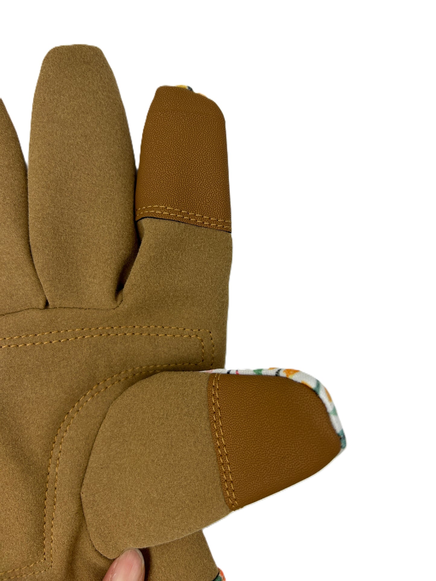 Close-up of a brown glove with a brand label on a white background